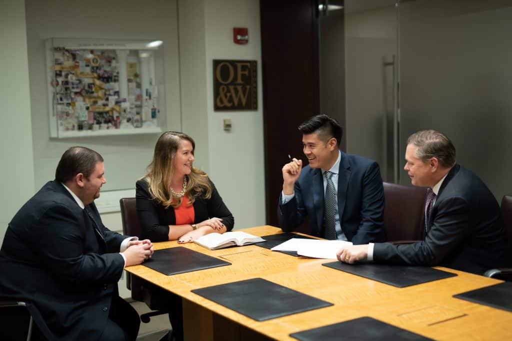 OFW law team sitting at a table