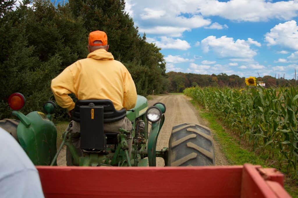 Farmer riding a tractor