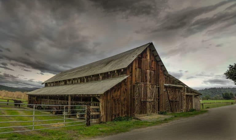 Farm with stormy clouds above
