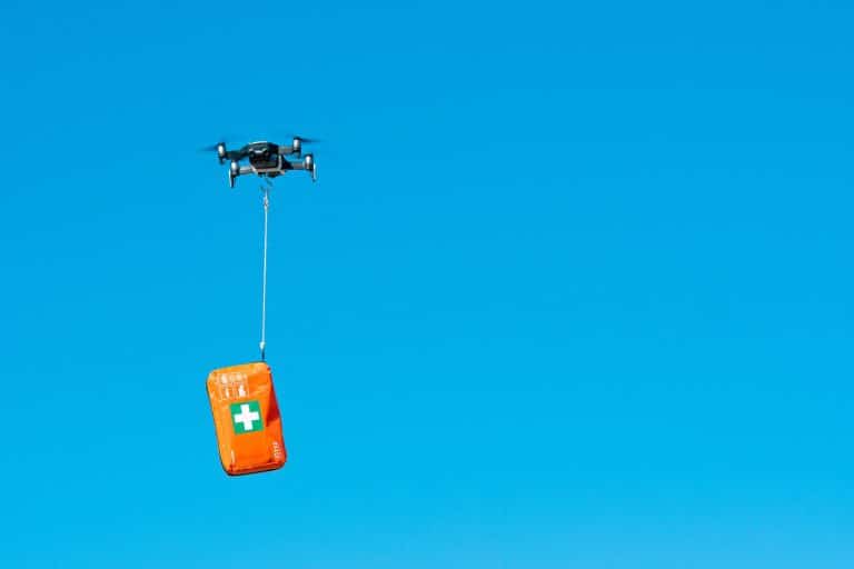 Drone delivering first aid kit