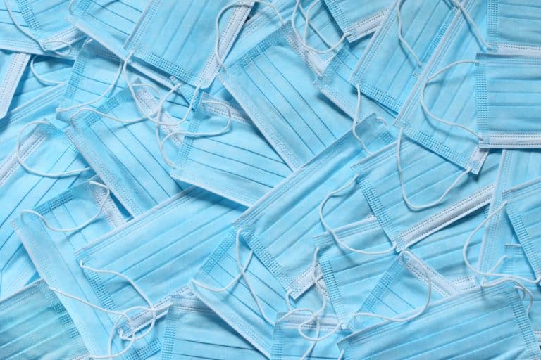 A big pile of bulk blue medical masks