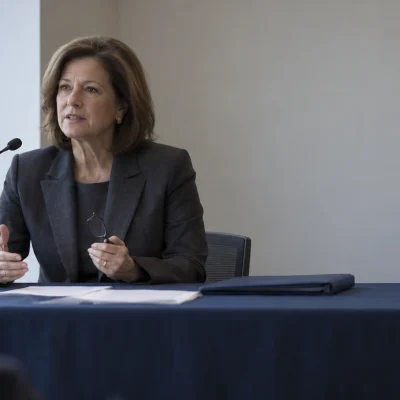 At a witness table, a food company executive rehearses her opening statement for legislative advocacy
